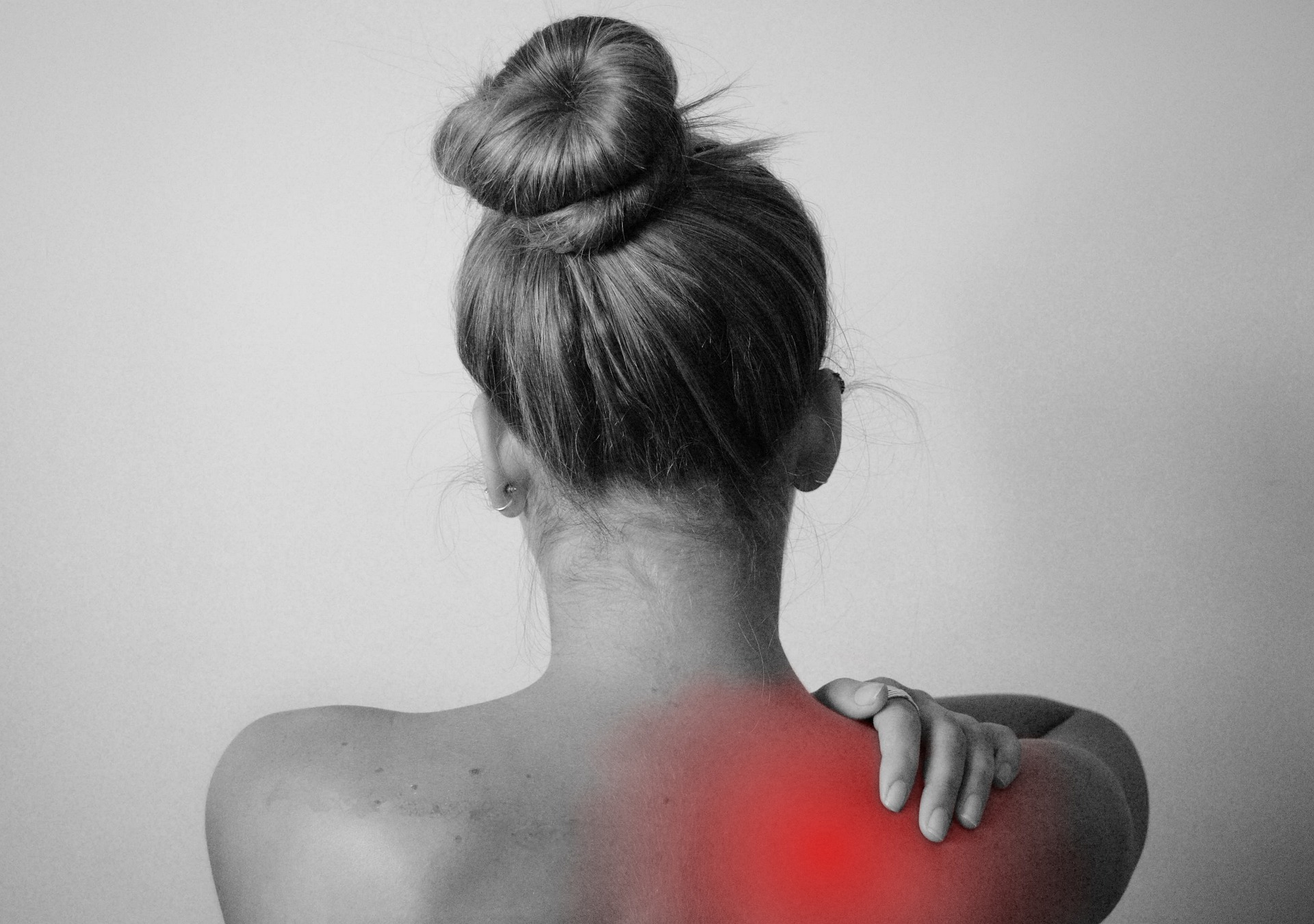 person indicating shoulder pain